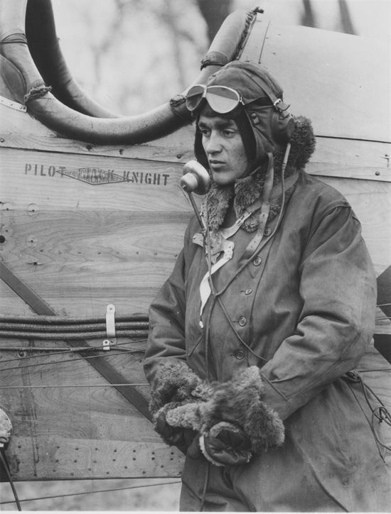 Jack Knight leaning against his plane